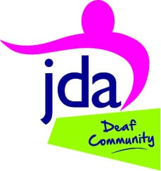 JDA Deaf Community logo with stylized pink figure above the blue letters "jda" and "Deaf Community" written in blue on a green background.